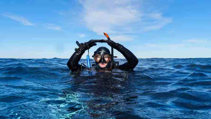 a scuba diver giving the okay signal