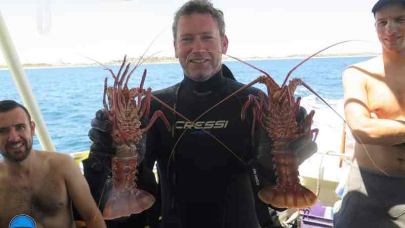 a couple of people that are standing in the water
