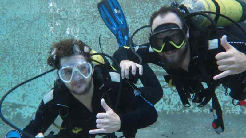 a group of people swimming in the water