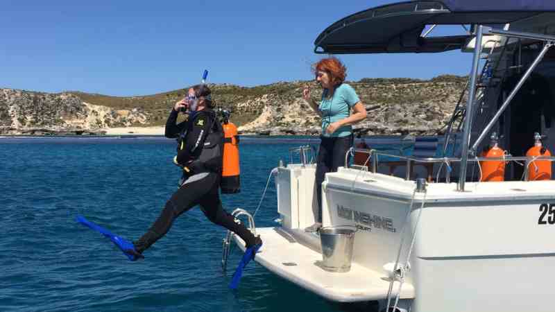 a group of people on a boat in the water