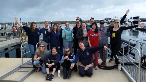 a group of people posing for the camera