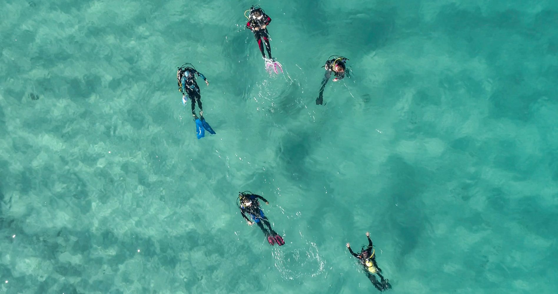 a drone picture of scuba divers