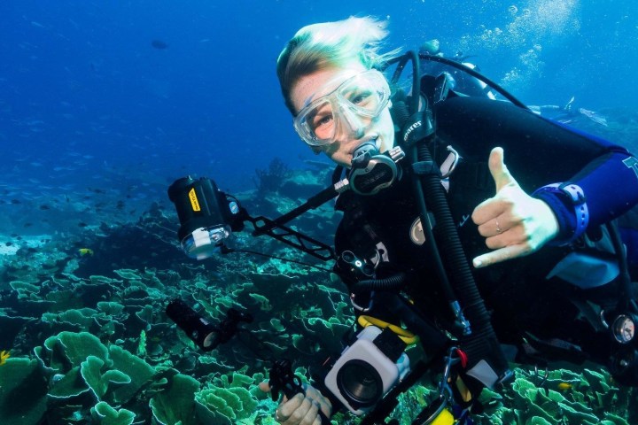 A scuba diver taking underwater photos