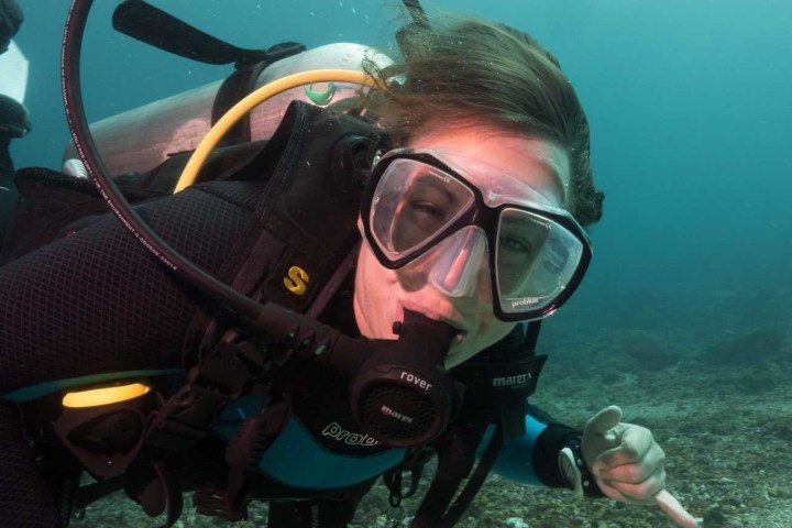 A PADI instructor posing during an Advanced course