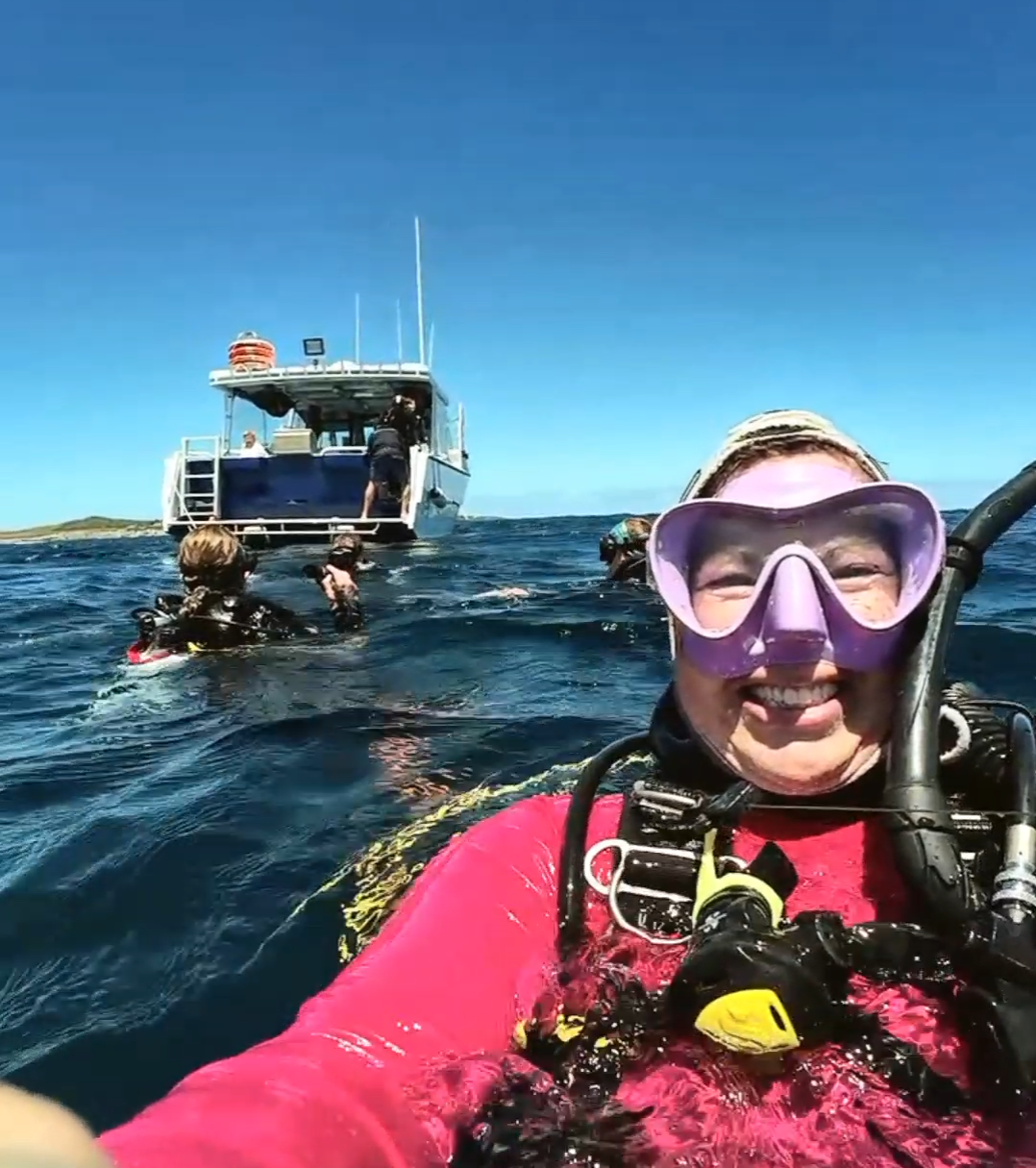 a person sitting on a boat in the water